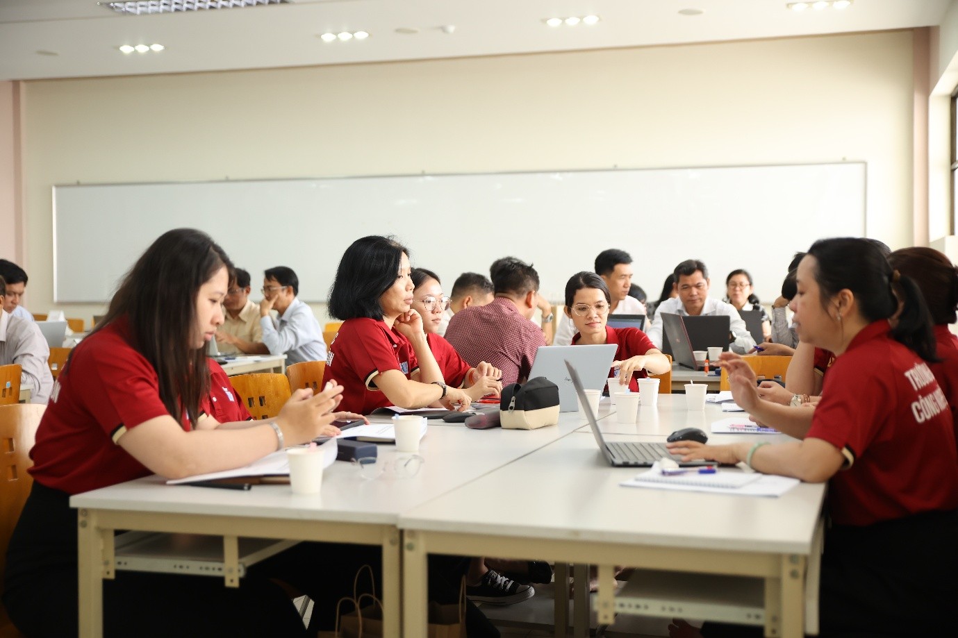 A group of people in a classroomAI-generated content may be incorrect.